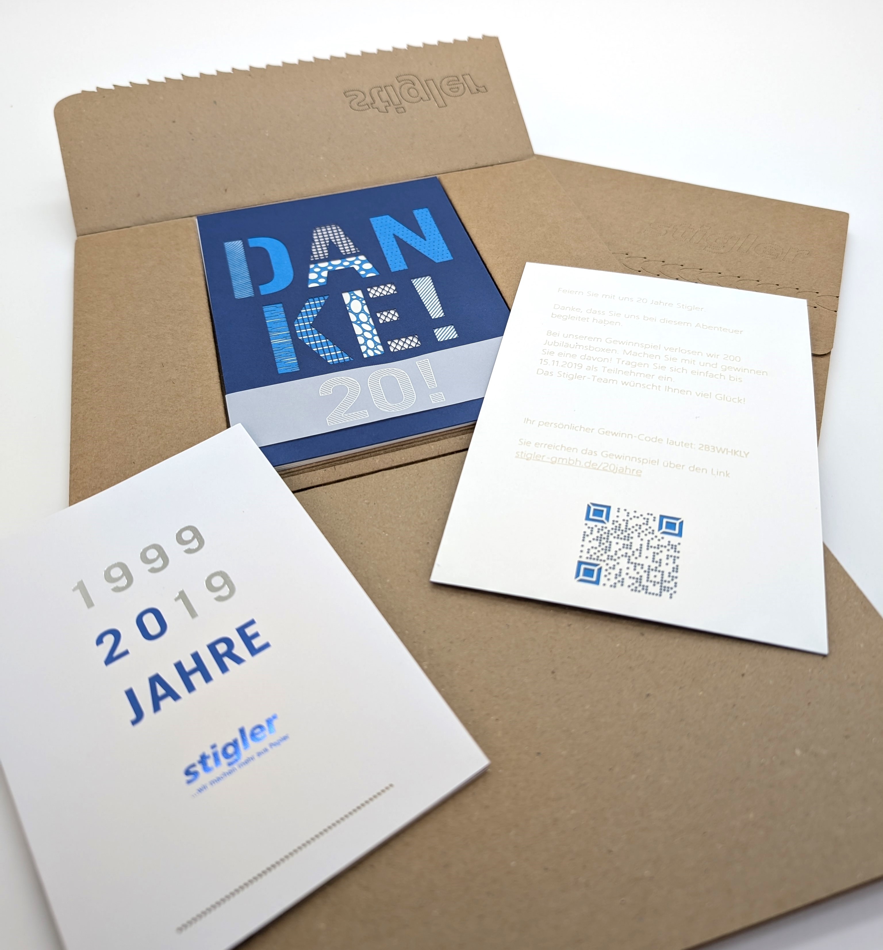 Jubiläumsmailing - Verpackung, Dankeskarte, Gewinnspiel und Flyer